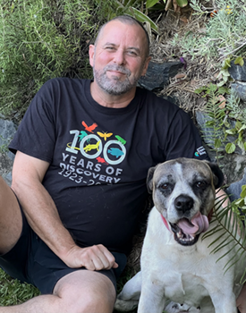 Professor Craig Franklin sat with his dog